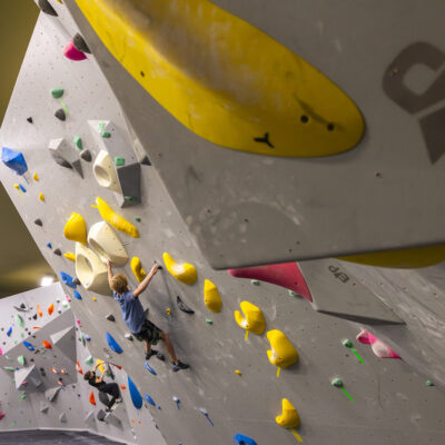 A young boy climbing at the Bend Endurance Academy in Bend, OR